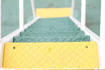 Green and Yellow Metal Diamond-plated Ladder High-angle Photography