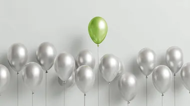 Green Balloon Rising Above Silver Balloons Green Balloon Rising Above Silver Balloons