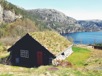 Green Brown and Red Wooden House on Green Grass