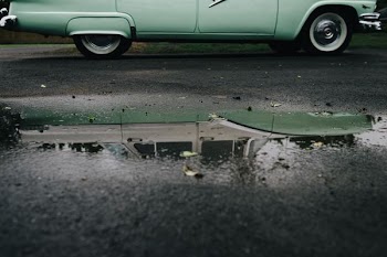 green car in the road