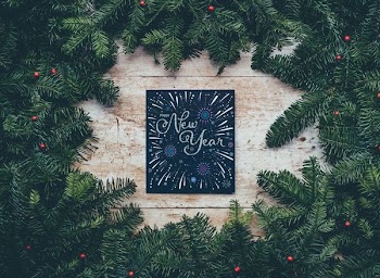 green Christmas decor with New Year greetings