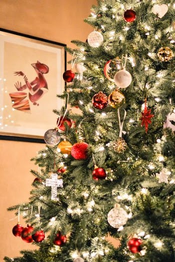 green Christmas tree with silver and red baubles