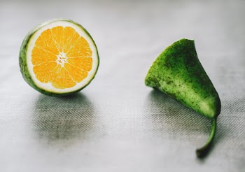 Green Citrus Fruit on Gray Surface