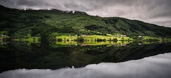 green covered mountain in panorama photography