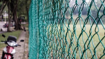 Green Cyclone Chain Fence
