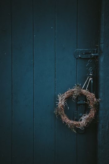 green door with wreath