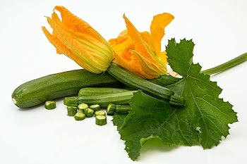 Green Elongated Vegetable With Yellow Flower