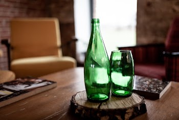 Green Glass Bottle And Drinking Glass