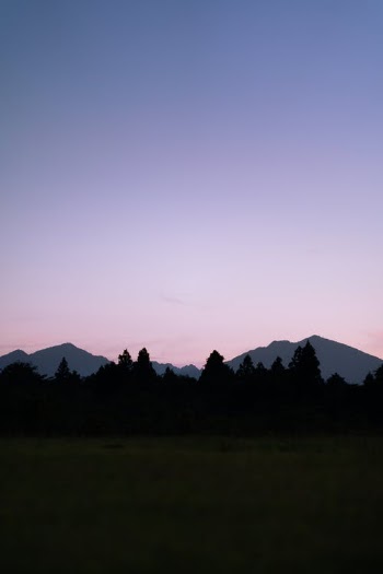 Green Grass Field Near Mountain · Free Stock Photo