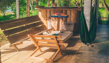 Green Hammock Near Wooden Patio Set
