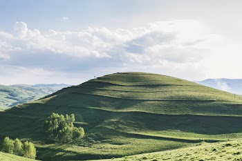 Green Hills Under White Sky