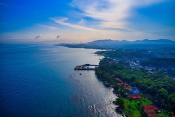 Green Island Under Blue Sky