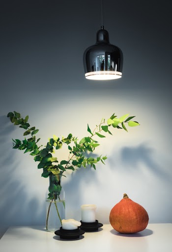 Green-leafed Plant Centerpiece Beside White Candles