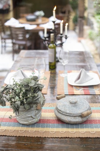 Green-leafed Plant in Vase Beside Cooking Pot With Lid on Table