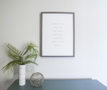 Green Leafed Plant Near Photo Frame