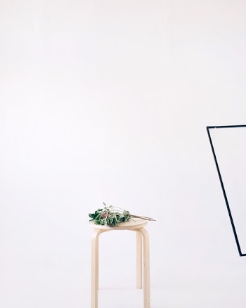 Green Leaves on Round Beige Wooden Stool Chair