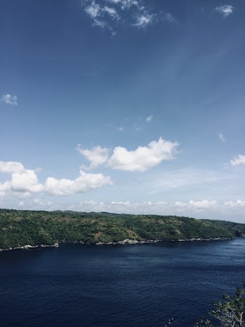 Green Mountain Near Body of Water