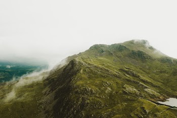 Green Mountain Under Gray Sky