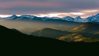 green mountain under gray sky