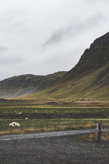 Green Mountains Across Dark Sky