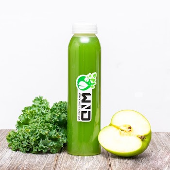 Green Plastic Bottle Beside Green Apple