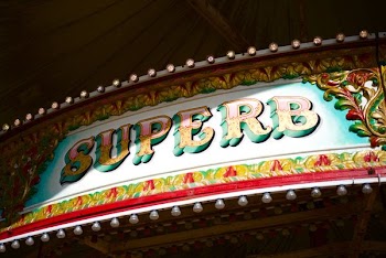 green, red, and yellow floral Super signage