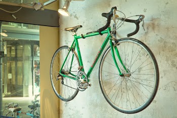 Green Road Bicycle Hanged on Wall