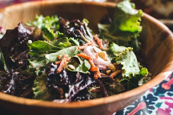 Green salad in a wooden bowl 