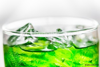 Green soda drink macro shot