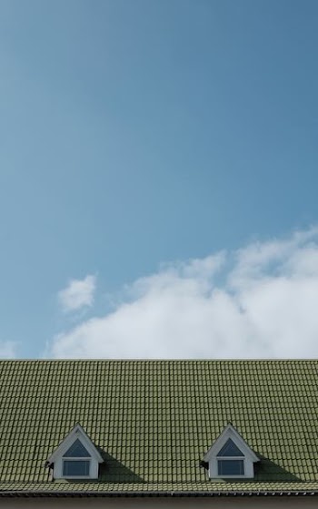green wooden house roof