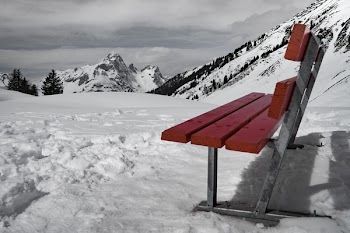 Grey and Brown Bench on Snow Near Mountain during Daytime