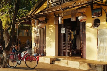 Grey and Red Bicycle Beside Building