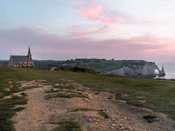 Grey and White Church on Top of Hill Facing Sea