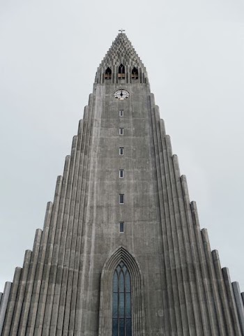grey and white concrete building in low angle photography