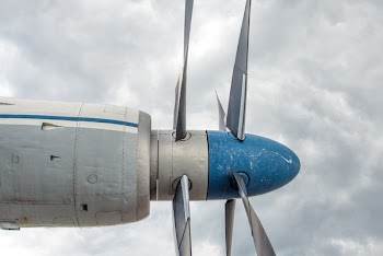 Grey Blue Plane over White Cloudes