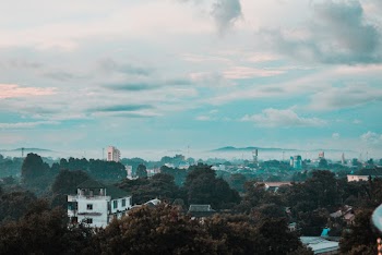 Grey Cloudy Blue Sky over City Skyline