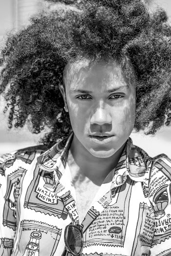 Grey scale  Photo of Man with Curly Hair