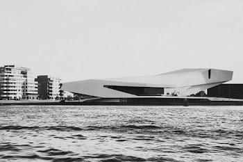 Grey-scale Photography of Building Near a body of water 