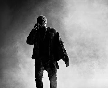 grey scale photography of man standing fronting fog