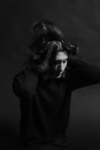 Grey scale Photography of Man Wearing Sweater