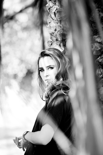 Grey Scale Photography of Woman Leaning