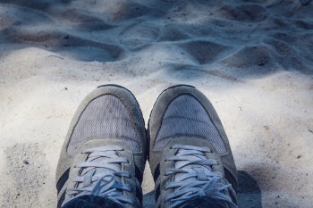 Grey Shoes on Top of Grey Sand