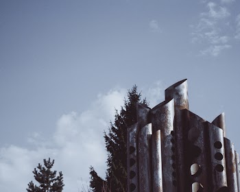 Grey Tower Near Green Leaf Tree