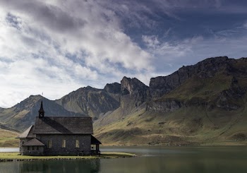 Grey Wooden House Near Mountain