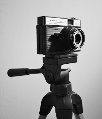Greyscale Photo Of Camera On Tripod