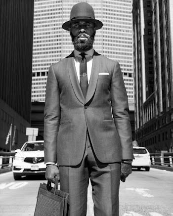Greyscale Photo of Man Wearing Suit and Fedora Hat