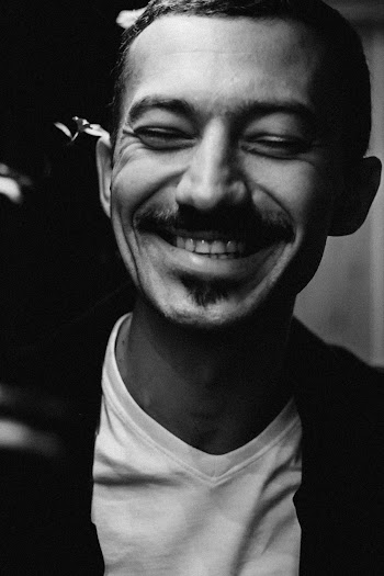 Greyscale Photo of Man Wearing White Shirt