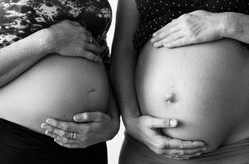 Greyscale Photo of Two Pregnant Women Touching Their Tummy