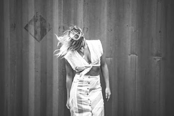Greyscale Photo of Woman Flipping Her Hair
