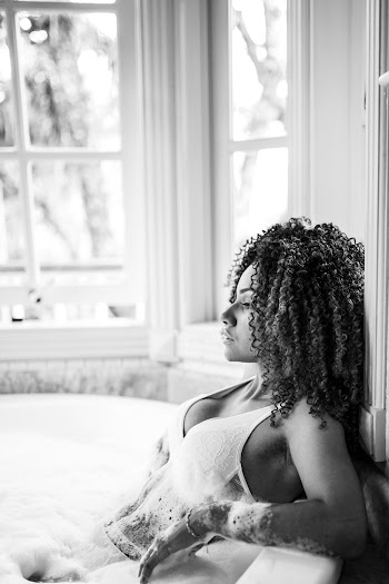 Greyscale Photo of Woman in Bath Tub